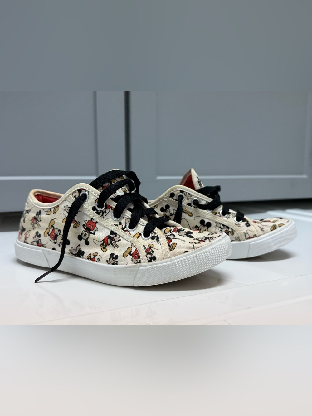 Disney Mickey Mouse Canvas Sneakers in Cream and Black with Red Lining